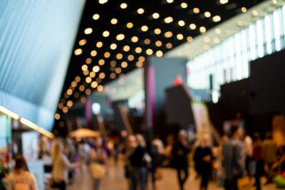 Blurred crowd of people in modern interior during event